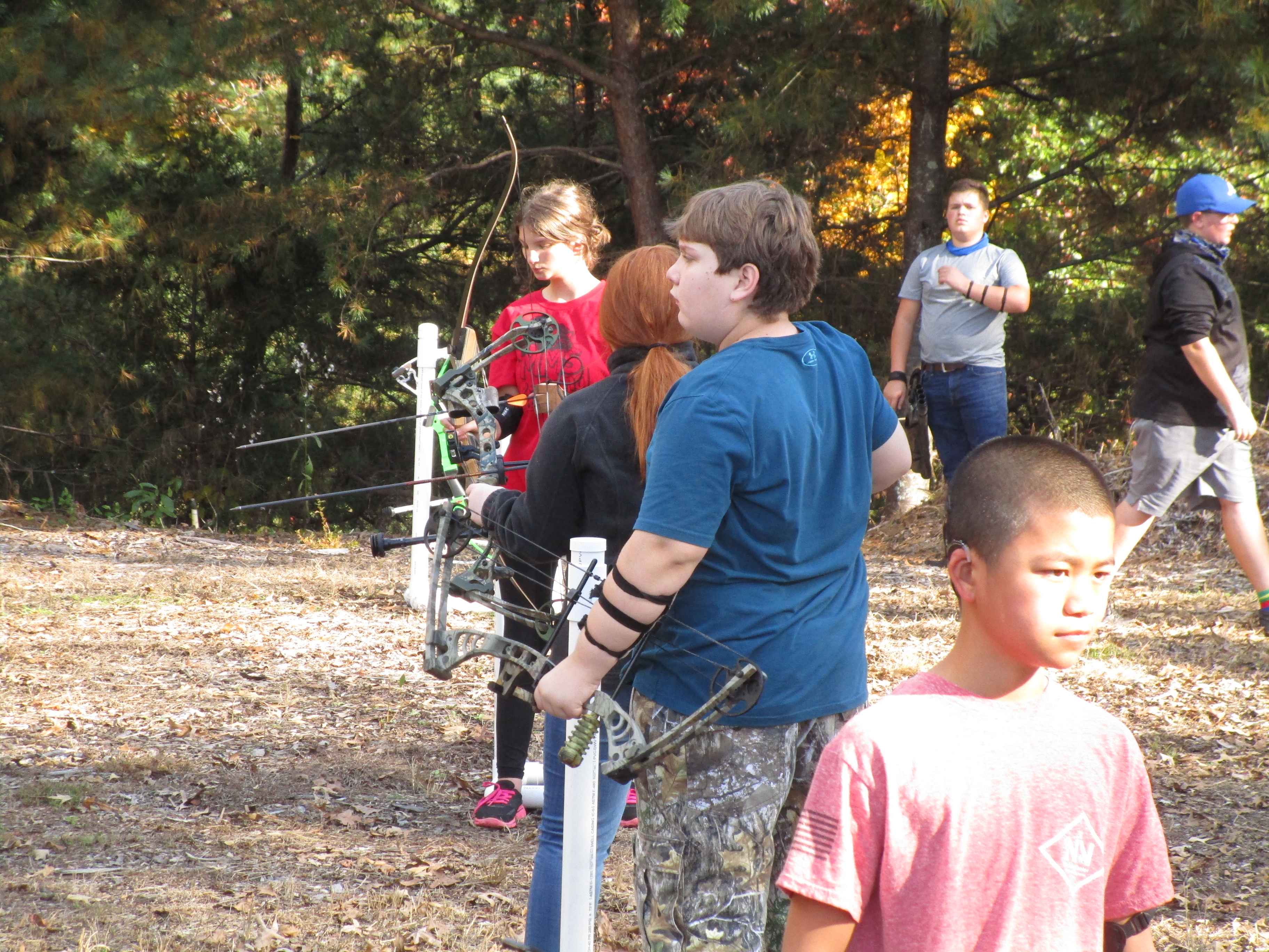 4-H Archery Club Member on the line shooting.