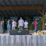 Students are awarded medals after the archery competition. 